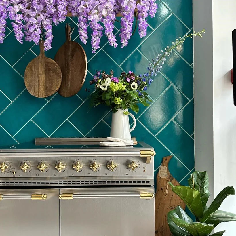 Stainless and gold trim lacanche cooker with flowers 